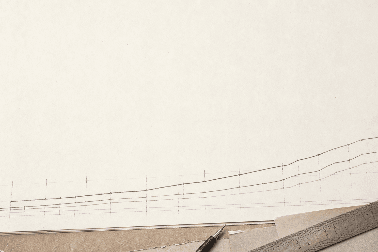 Wide light-dominant illustration showing a near-white drafting surface with a low band of fine ink cost-curve lines rising in gentle steps along the bottom third of the frame, accented with sparse violet tick marks against the pale background.